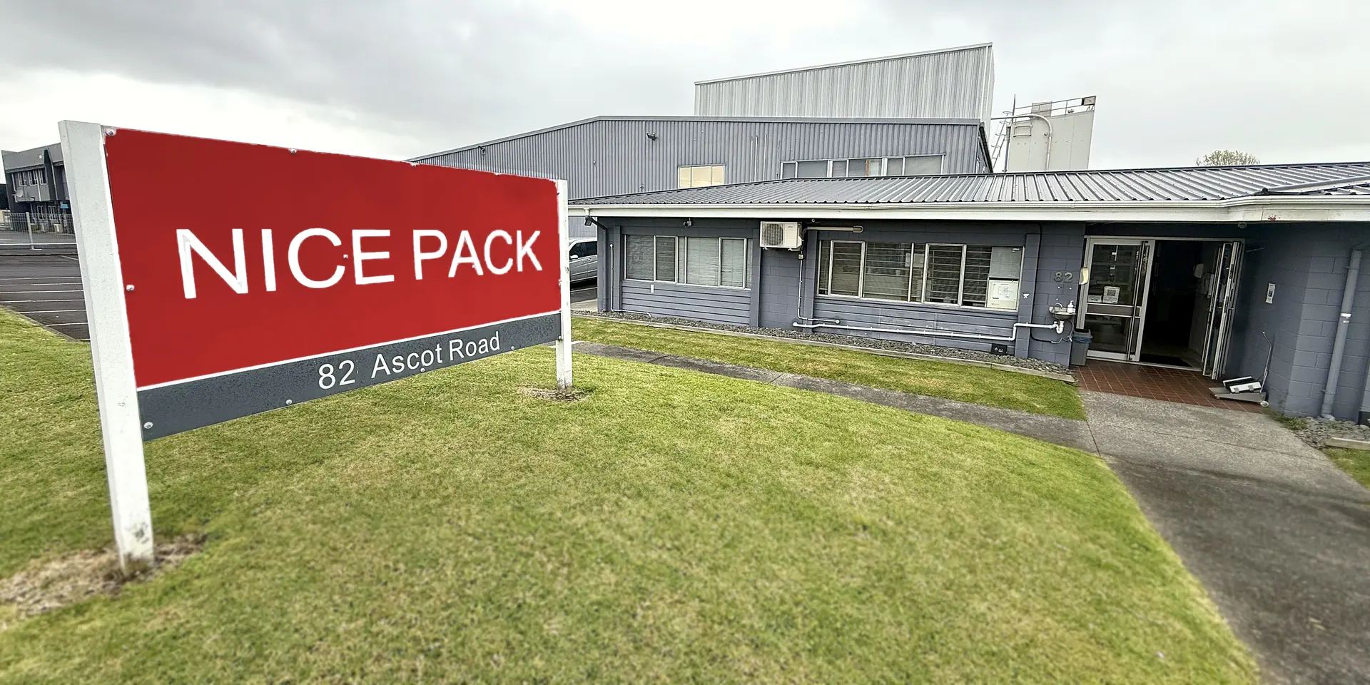 The Nice Pack sign and building at 82 Ascot Road, Auckland